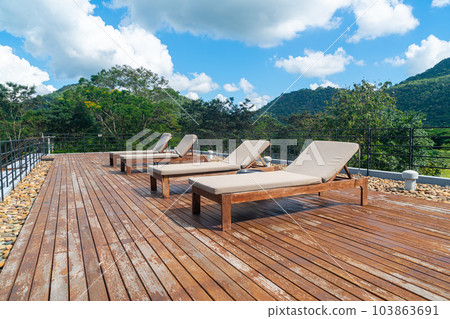 sun bed with mountain hill and blue sky background 103863691