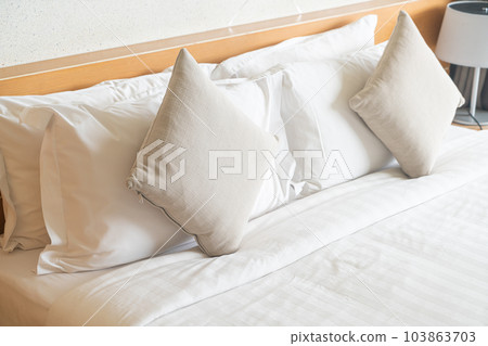 beautiful and comfortable pillows decoration on bed 103863703