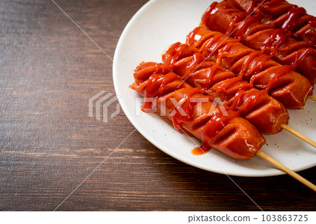fried sausage skewer with ketchup fried sausage skewer with ketchup 103863725