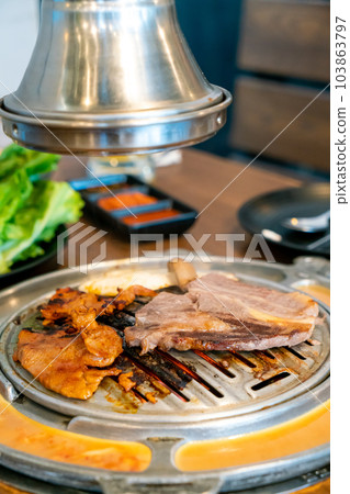 grilled meat in Korean style or Korean BBQ grilled meat in Korean style or Korean BBQ 103863797