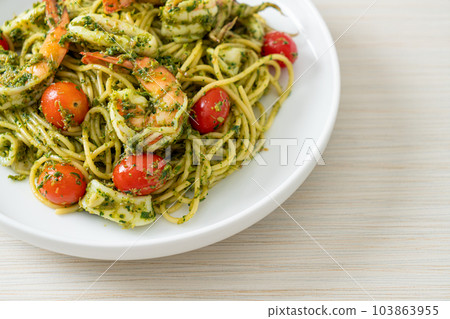 Spaghetti with seafood in homemade pesto sauce Spaghetti with seafood in homemade pesto sauce 103863955