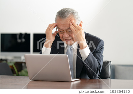 Businessman worry laptop computer 103864120