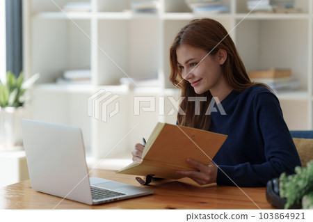 Beautiful young Asian woman college student at classroom. College student working on the college campus. back to school concept Beautiful young Asian woman college student at classroom. College student working on the college campus. back to school concept 103864921