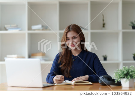 Beautiful young Asian woman college student at classroom. College student working on the college campus. back to school concept 103864922