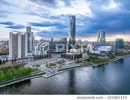 Yekaterinburg city and pond aerial panoramic view at summer sunset. Yekaterinburg city and pond aerial panoramic view at summer sunset. 103865354