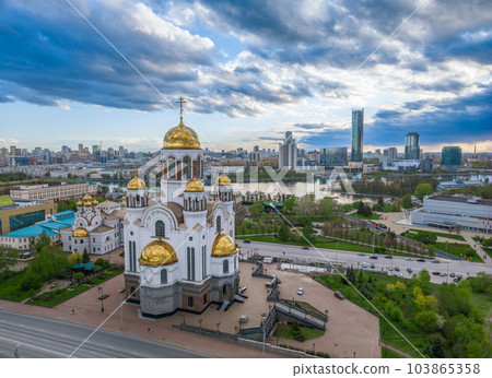 Summer Yekaterinburg and Temple on Blood in cloudy sunset. Aerial view of Yekaterinburg, Russia. Translation of the text on the temple Summer Yekaterinburg and Temple on Blood in cloudy sunset. Aerial view of Yekaterinburg, Russia. Translation of the text on the temple 103865358