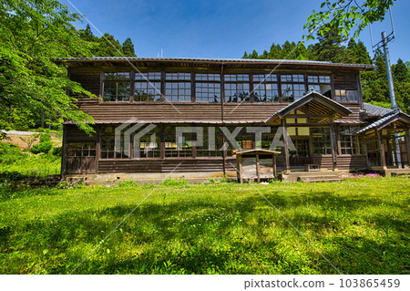 Abandoned school building standing quietly Abandoned school building standing quietly 103865459