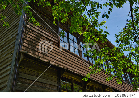 Abandoned school building standing quietly 103865474