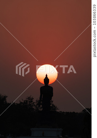Head of statue of Buddha image surrounded by sun. Head of statue of Buddha image surrounded by sun. 103866339