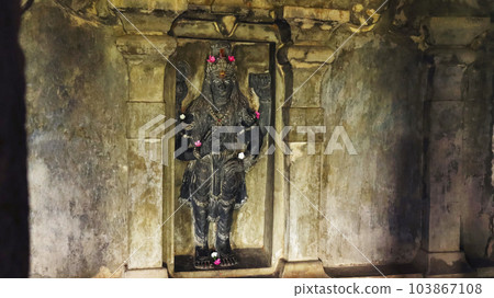Carved sculpture of Lord Vishnu Inside the Undavalli Caves, Vijayawada, Andhra Pradesh, India. 103867108