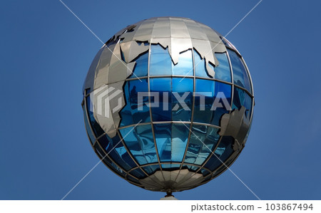 Kiev, Ukraine November 28, 2020: Globe on the building of the Ministry of Infrastructure of Ukraine in the center of Kiev Kiev, Ukraine November 28, 2020: Globe on the building of the Ministry of Infrastructure of Ukraine in the center of Kiev 103867494