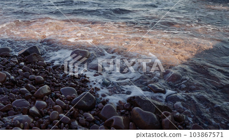 Slow motion closeup shot of clear sea water on Saint Raphael beach 103867571