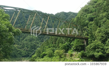 A railroad bridge where a single rail car wants to run 103867939
