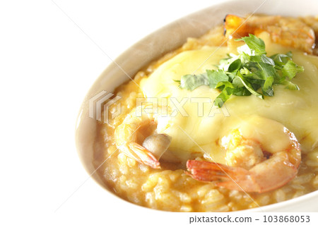 Shrimp, cheese, coriander, hot tom yum risotto shot against a white background Shrimp, cheese, coriander, hot tom yum risotto shot against a white background 103868053
