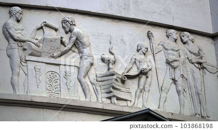Kiev, Ukraine April 13, 2021: Architectural decorations, frescoes on a building with different subjects from ancient legends in the city of Kiev Kiev, Ukraine April 13, 2021: Architectural decorations, frescoes on a building with different subjects from ancient legends in the city of Kiev 103868198