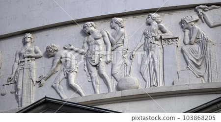 Kiev, Ukraine April 13, 2021: Architectural decorations, frescoes on a building with different subjects from ancient legends in the city of Kiev 103868205