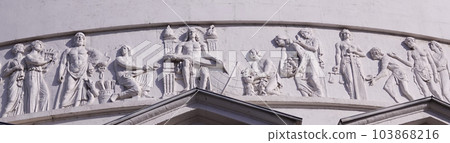 Kiev, Ukraine April 13, 2021: Architectural decorations, frescoes on a building with different subjects from ancient legends in the city of Kiev Kiev, Ukraine April 13, 2021: Architectural decorations, frescoes on a building with different subjects from ancient legends in the city of Kiev 103868216