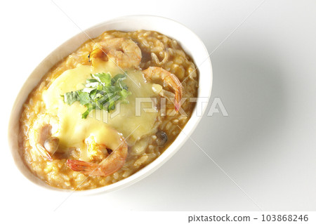 Shrimp, cheese, coriander, and hot tom yum risotto on a white background Shrimp, cheese, coriander, and hot tom yum risotto on a white background 103868246