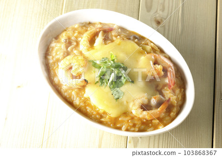 A bird's-eye view of shrimp, cheese, coriander, and hot tom yum risotto A bird's-eye view of shrimp, cheese, coriander, and hot tom yum risotto 103868367