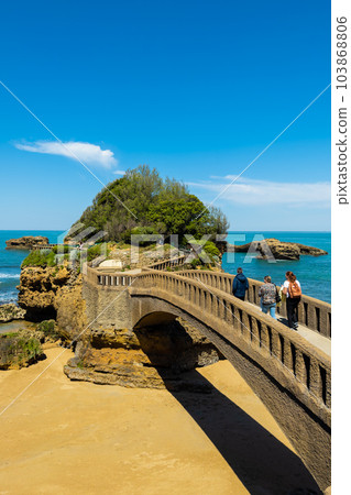 Stone bridge to the Rocher du Basta, the scenic rock and major landmark in the coast of Biarritz 103868806