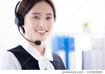 woman working in a call center woman working in a call center 103868894