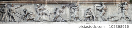 Kiev, Ukraine November 28, 2020: Artistic decor of the facade of the building a bas-relief with different stories from people's lives 103868916