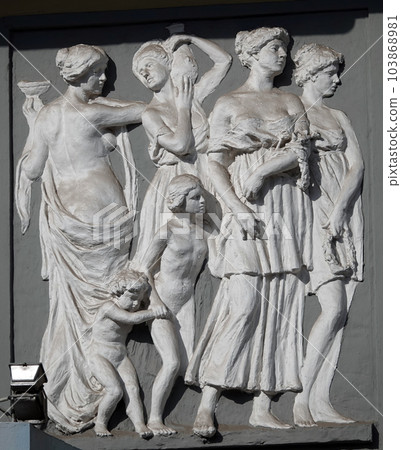 Kiev, Ukraine June 10, 2020: Artistic decoration of the facade of the building with sculptures of people in the city of Kiev Kiev, Ukraine June 10, 2020: Artistic decoration of the facade of the building with sculptures of people in the city of Kiev 103868981