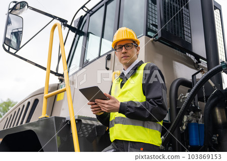 Engineer with mining truck Engineer with mining truck 103869153