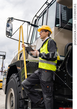 Engineer with mining truck Engineer with mining truck 103869161