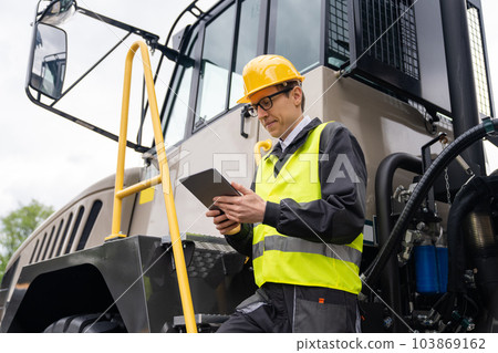 Engineer with mining truck Engineer with mining truck 103869162