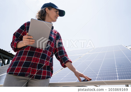 Woman with solar power station 103869169