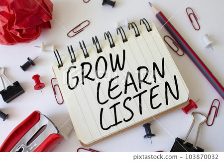 Grow Learn Listen symbol. Concept words Grow Learn Listen on white notebook. Beautiful white background. Business and Grow Learn Listen concept. Copy space 103870032