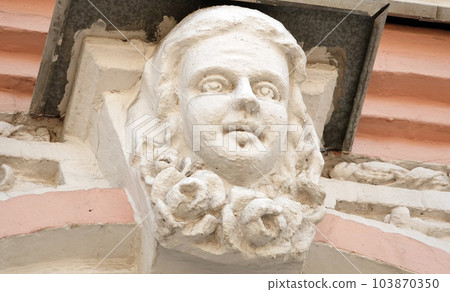 Kiev, Ukraine June 10, 2020: Artistic decoration of the facade of the building with sculptures of people in the city of Kiev Kiev, Ukraine June 10, 2020: Artistic decoration of the facade of the building with sculptures of people in the city of Kiev 103870350