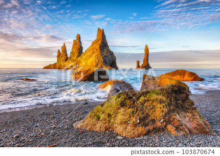 Breathtaking view of rock formations Troll Toes on Black beach Reynisfjara near the village of Vik. Breathtaking view of rock formations Troll Toes on Black beach Reynisfjara near the village of Vik. 103870674