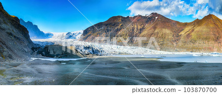 Breathtaking view of Skaftafellsjokull glacier tongue and volcanic mountains around on South Iceland. Breathtaking view of Skaftafellsjokull glacier tongue and volcanic mountains around on South Iceland. 103870700