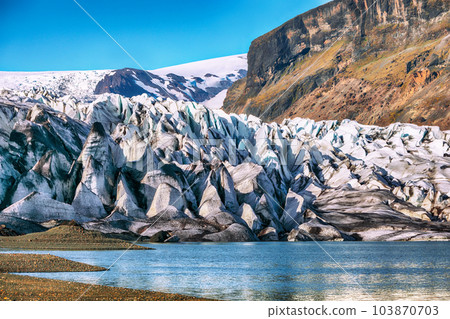 Breathtaking view of Skaftafellsjokull glacier tongue and volcanic mountains around on South Iceland. Breathtaking view of Skaftafellsjokull glacier tongue and volcanic mountains around on South Iceland. 103870703