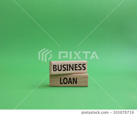 Business loan symbol. Concept words business loan on wooden blocks. Beautiful green background. Business and business loan concept. Copy space. 103870719