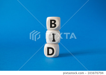 BID symbol. Concept word BID on wooden blocks. Beautiful blue background. Business and BID concept. Copy space BID symbol. Concept word BID on wooden blocks. Beautiful blue background. Business and BID concept. Copy space 103870794