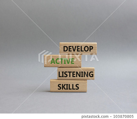 Listening skills symbol. Concept word Develop active listening skills on wooden blocks. Beautiful grey background. Business and Develop active listening skills concept. Copy space Listening skills symbol. Concept word Develop active listening skills on wooden blocks. Beautiful grey background. Business and Develop active listening skills concept. Copy space 103870805
