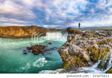 Breathtaking landscape scene of powerful Godafoss waterfall. 103870831