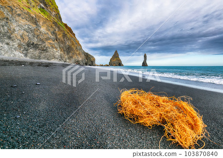 Gorgeous landscape with basalt rock formations Troll Toes on Black beach Reynisfjara near the village of Vik. Location Gorgeous landscape with basalt rock formations Troll Toes on Black beach Reynisfjara near the village of Vik. Location 103870840