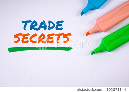 TRADE SECRETS. Text and colored markers on a white background 103871144