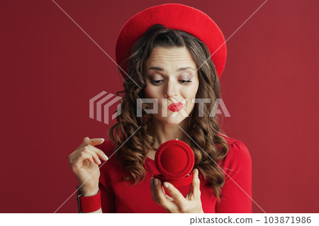 unhappy stylish woman in dress and beret on background 103871986