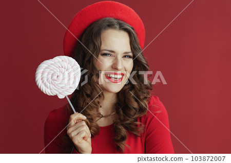 happy elegant female in red dress and beret happy elegant female in red dress and beret 103872007