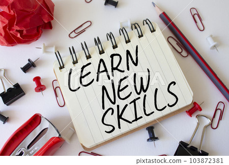 Learn new skills symbol. Concept words Learn new skills on white notebook. Beautiful white background. Business and Learn new skills concept. Copy space. 103872381