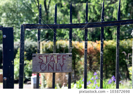 Old Staff Only Sign on an Ancient Country Estate Gate 103872698