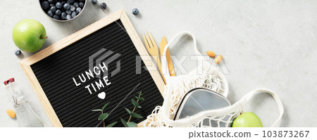 Lunch time letter board and healthy food flat lay 103873267