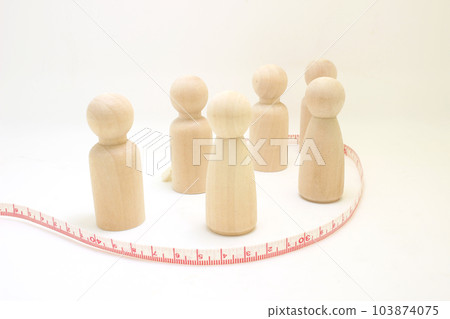 the Wooden figures of people stand in a row. the Wooden figures of people stand in a row. 103874075