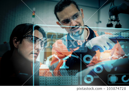 Multiracial tachnicial engineer training with robot arm Multiracial tachnicial engineer training with robot arm 103874728