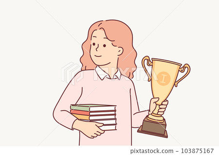 Schoolgirl with trophy gold cup and books in hands rejoices in victory in school olympiad 103875167